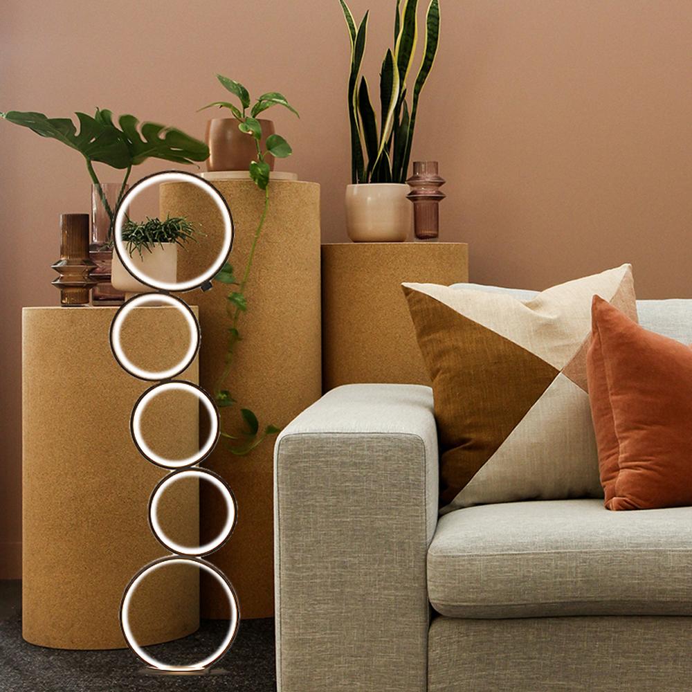 Create a chic minimalistic look in your home with standing ring lamp design on the side of sofa
