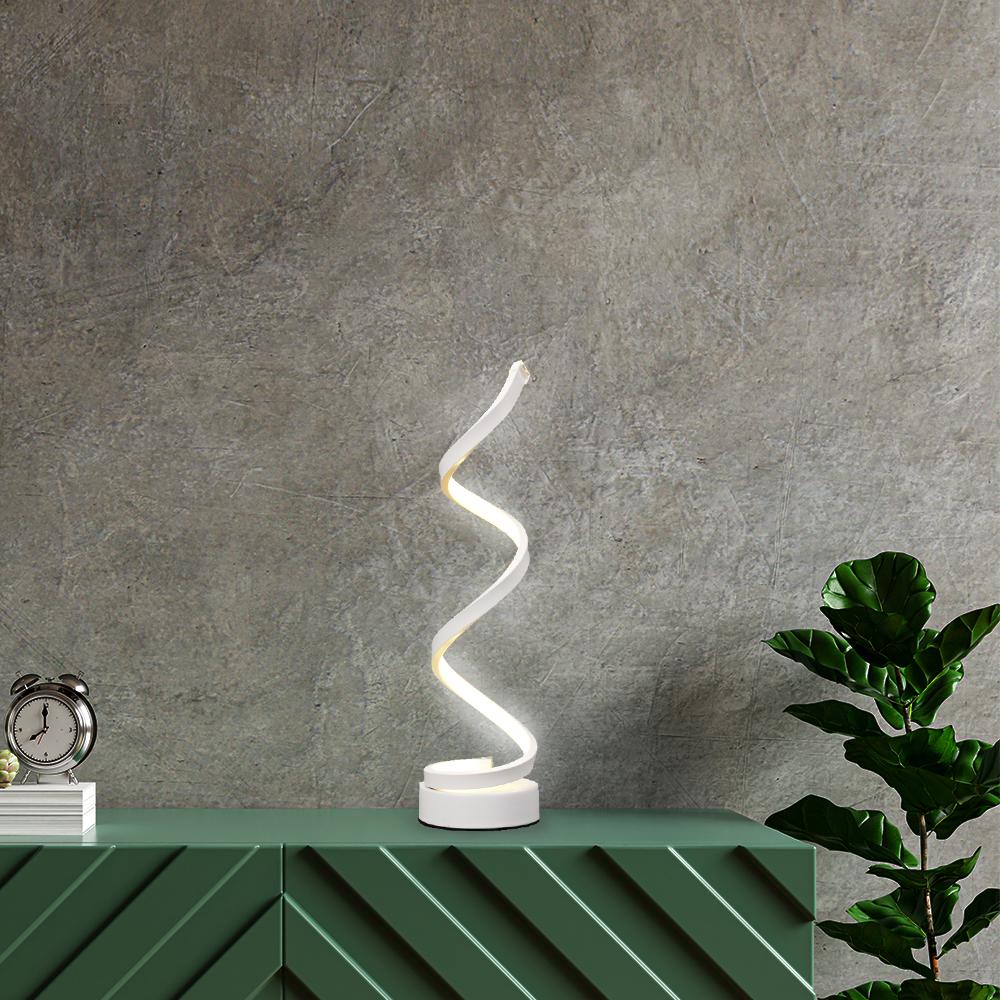 spiral table lamp on the desk