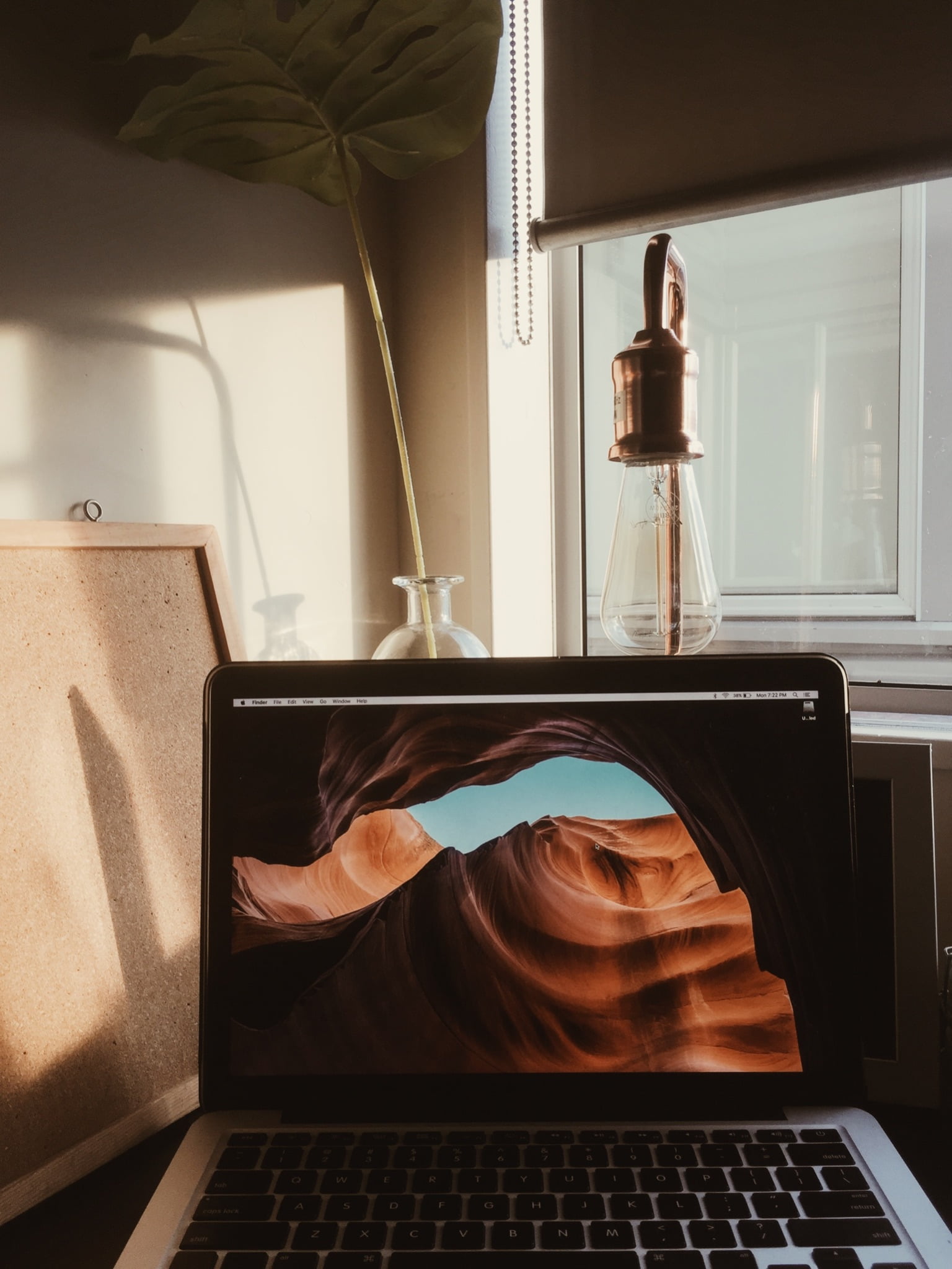 MacBook showing cave wallpaper