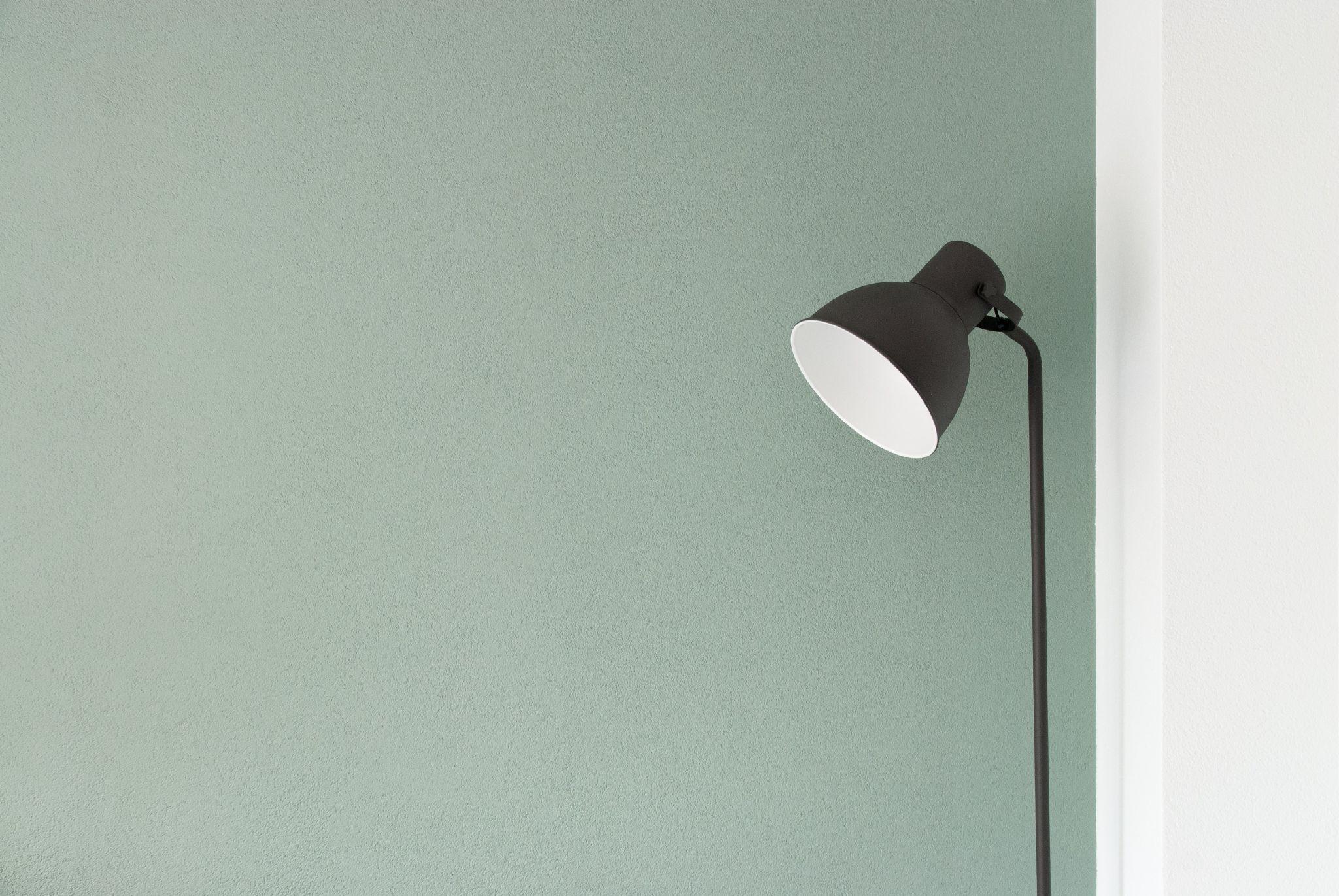 green wall paint and lamp. choosing right color help to make home feel relaxing